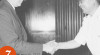 Foto Menteri Penerangan Wilhelm Johannis Rumambi berjabat tangan dengan Duta Besar Swiss, Jean Reinnce. Pertemuan di Jakarta, 7 Juni 1966.